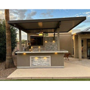 Kokomo Grills Best Outdoor Kitchen Bermuda BBQ Island with pergola, stone backsplash, built-in TV, and under-counter lighting