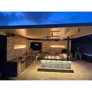 Kokomo Grills Luxury Outdoor Kitchen BBQ Grill Island with stainless steel, quartz countertops, integrated storage, and built-in lighting under covered patio.