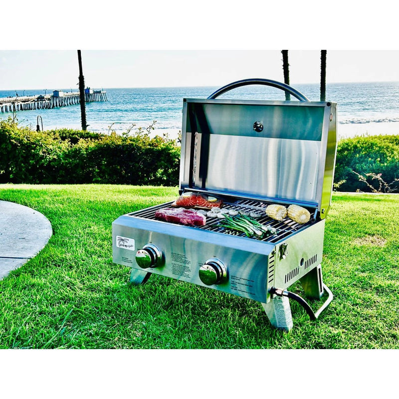 Kokomo Grills On The Go portable stainless steel grill with dual burners, temperature gauge, carry handle, and 266.5 sq. inch surface.