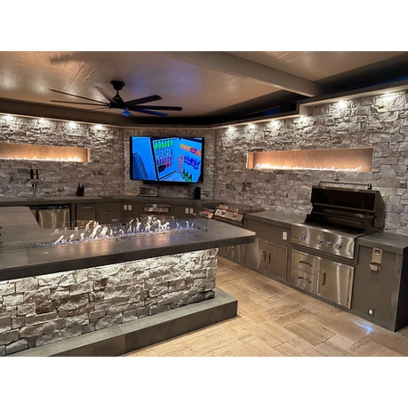 Kokomo Grills Luxury Outdoor Kitchen BBQ Grill Island with stainless steel grill, stone countertops, fire pit, and built-in storage cabinets.