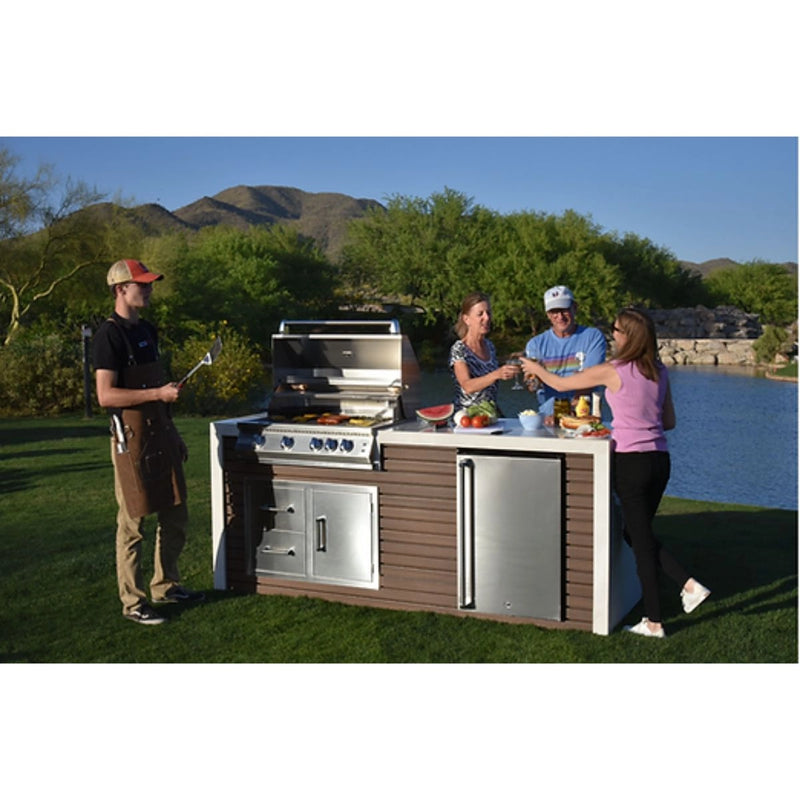 Kokomo Grills Professional Shiplap Outdoor Kitchen with 7'6" porcelain countertop, stainless steel grill, fridge, and storage drawers.