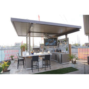 Kokomo Grills Best Outdoor Kitchen Bermuda BBQ Island with pergola, oversized TV, stainless steel storage, and built-in fire pit.