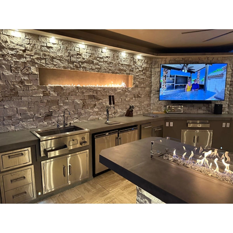 Kokomo Grills Luxury Outdoor Kitchen BBQ Grill Island with stainless steel cabinetry, built-in sink, and sleek countertop fire feature.