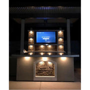 Kokomo Grills St. Croix Outdoor Kitchen with built-in TV, stone back wall, under-counter lighting, and 12x12 patio cover.