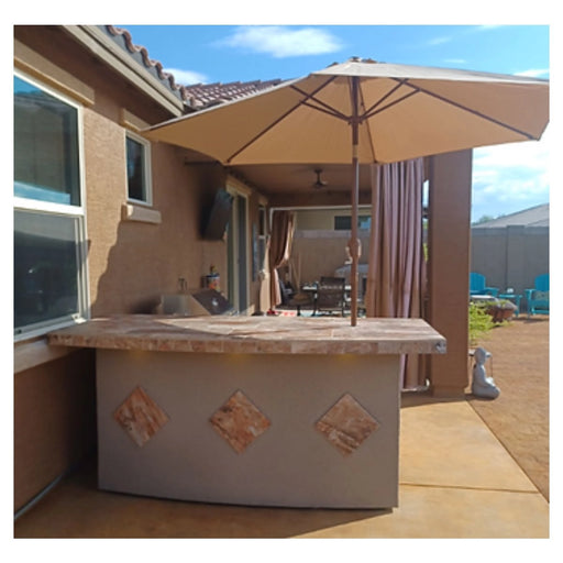 Kokomo Grills Caribbean BBQ Island with 4 Burner Grill, tile countertop, stucco finish, and bar umbrella for outdoor entertaining.