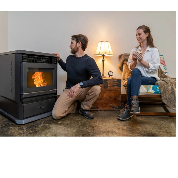 Man and woman in a living room with a pellet stove.