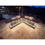 Kokomo Grills Luxury Outdoor Kitchen BBQ Grill Island with stainless steel cabinets, fire feature, and L-shaped quartz countertop.