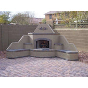 Kokomo Grills Santa Fe Outdoor Fireplace – Corner with Spectrum Brown stucco base, 90-degree design, and gas log set flames.