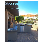 Kokomo Grills Aruba BBQ Island with 6' L-shape, Spectrum Brown stucco, tile countertop, built-in grill, side burner, fridge, and raised bar.