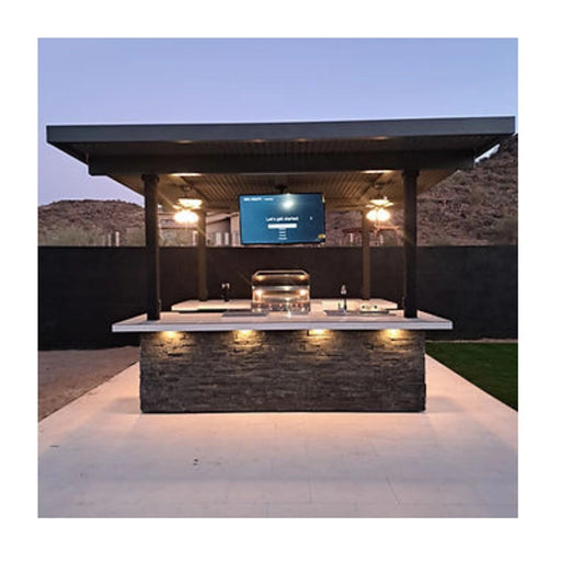 Kokomo Grills Big Island Sports Bar Outdoor Kitchen Grill with dual 55-inch TVs, stainless steel doors, and stone facade island.