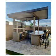 Kokomo Grills St. Croix Outdoor Kitchen with built-in 4 burner BBQ grill, 12x12 patio cover, stone back wall, and bar seating.