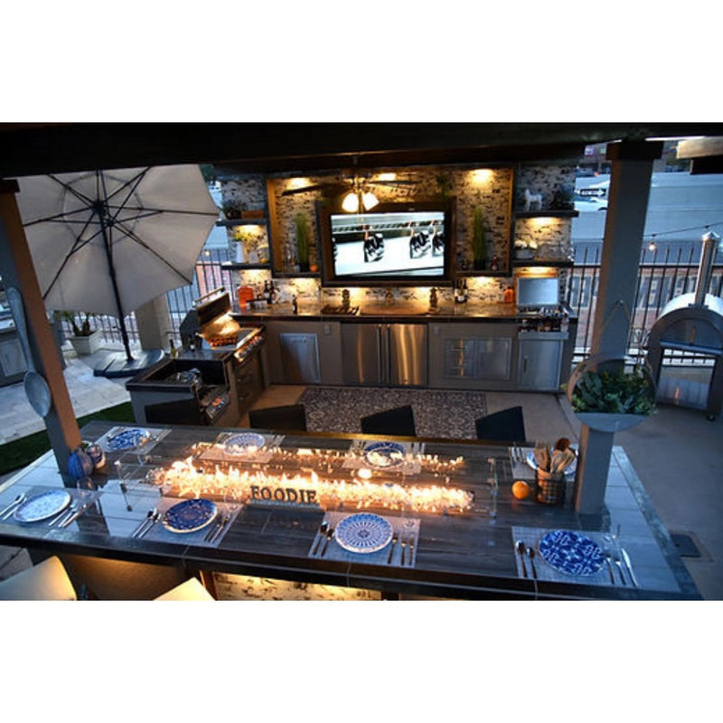 Kokomo Grills Outdoor Kitchen Montego Model BBQ Island with built-in grill, stainless steel storage, and modern outdoor cooking setup