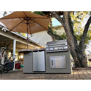Kokomo Grills Maui 7'6" BBQ Island with 33" round bar, 4-burner grill, stainless fridge, LED lights, and brown stucco finish.