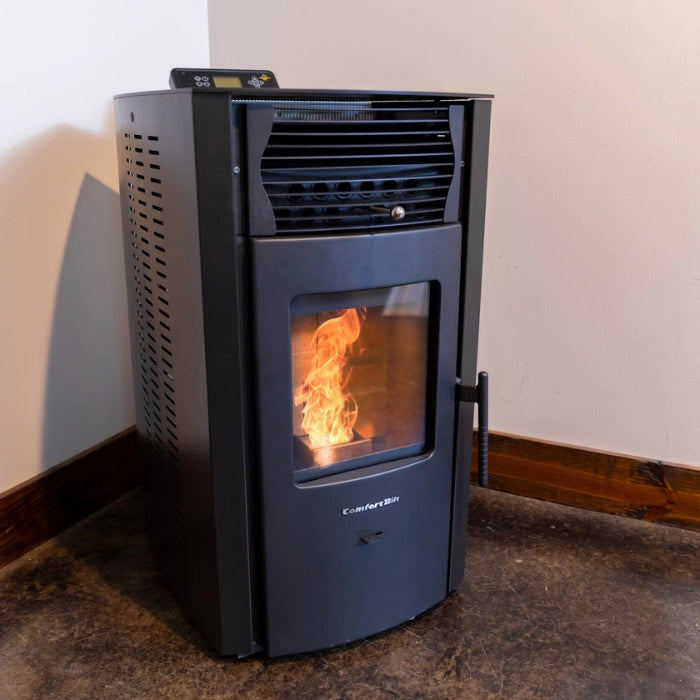 Black pellet stove with visible flames inside, mounted on a wall.