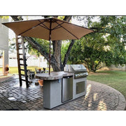 Kokomo Grills Maui 7'6" BBQ Island with 33" round bar, Spectrum Brown stucco, porcelain tile, LED lights, fridge, and built-in grill.