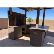 Kokomo Grills Barn Door TV Wall BBQ Island with 4 Burner BBQ, stone accents, barn doors, and curved serving bar under shade canopy