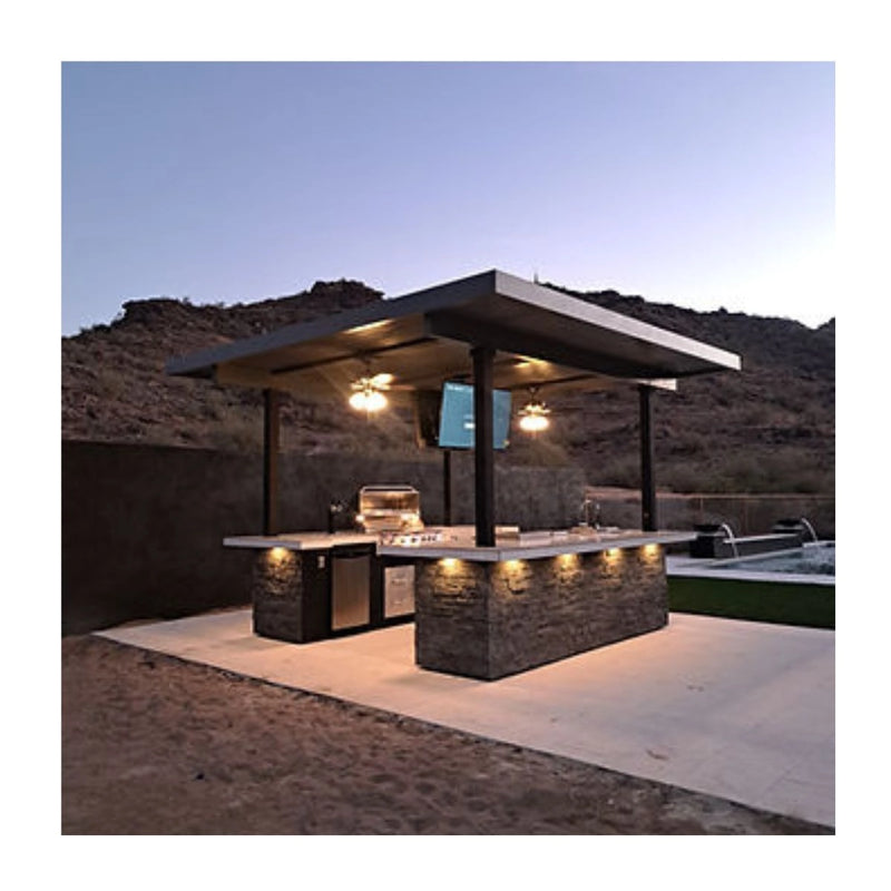 Kokomo Grills Big Island Sports Bar Outdoor Kitchen Grill with dual 55-inch TVs, stainless steel doors, and stone facade under covered patio