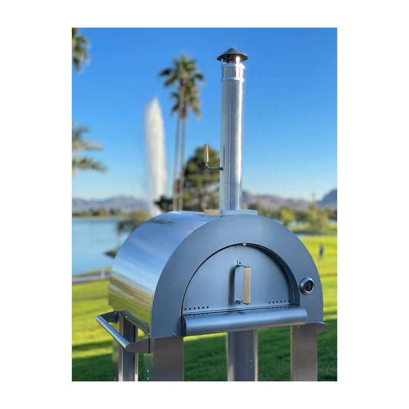 Kokomo Grills 32” Wood Fired Stainless Steel Pizza Oven with chimney, front door handle, temperature gauge, and wood-burning design on cart.