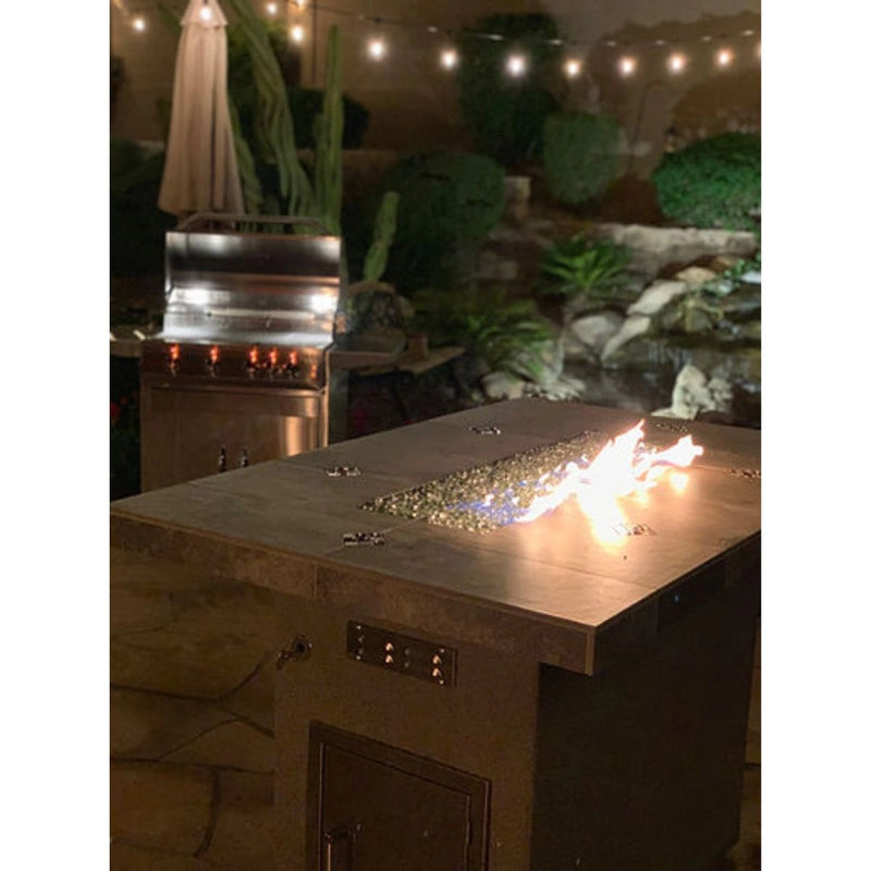 Kokomo Grills Entertainer Bar Gas Fire Pit Table with fire glass, 6' x 42", metal and tile construction, glowing flame centerpiece.