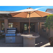 Kokomo Grills Aruba BBQ Island with 4-burner grill, side burner, refrigerator, tile countertop, and round bar in Spectrum Brown.