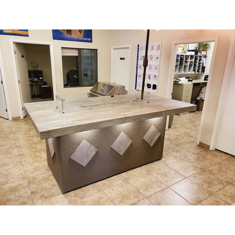 Kokomo Grills Baja/Fire L-Shaped BBQ Island with fire pit, 4 burner grill, outdoor refrigerator, and modular galvanized steel frame.