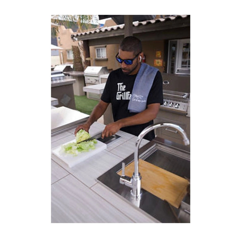 Kokomo Grills Trash Chute and Cutting Board stainless steel with integrated trash chute and cutting surface in outdoor kitchen setup.