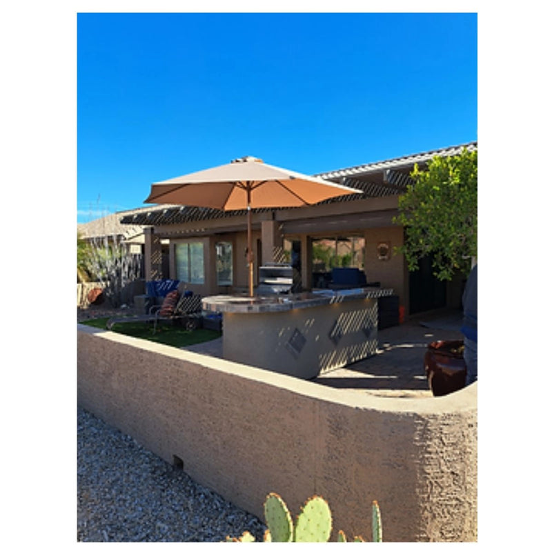 Kokomo Grills Aruba BBQ Island L-shape 6'x9'6" with Spectrum Brown stucco, 4-burner grill, side burner, fridge, and round bar.