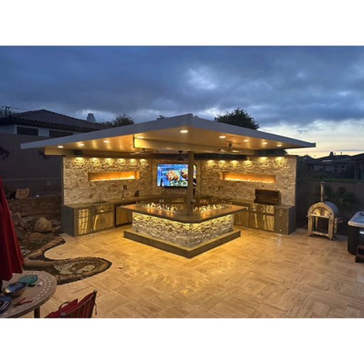 Kokomo Grills Luxury Outdoor Kitchen BBQ Grill Island with stainless steel, stone countertops, integrated lighting, and storage cabinets.