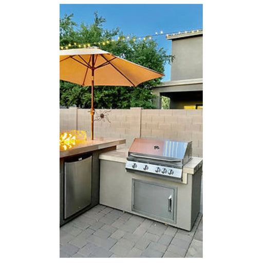 Kokomo Grills Baja/Fire L-Shaped BBQ Island with 4 burner stainless steel grill, outdoor fridge, and fire pit.