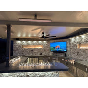 Kokomo Grills Luxury Outdoor Kitchen BBQ Grill Island with stone countertops, built-in TV, stainless steel appliances, and modern lighting.