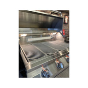 Kokomo Grills Laser Cut Grate 32In Professional Built-in Gas Grill with 4 stainless steel burners, knobs, and interior lighting.