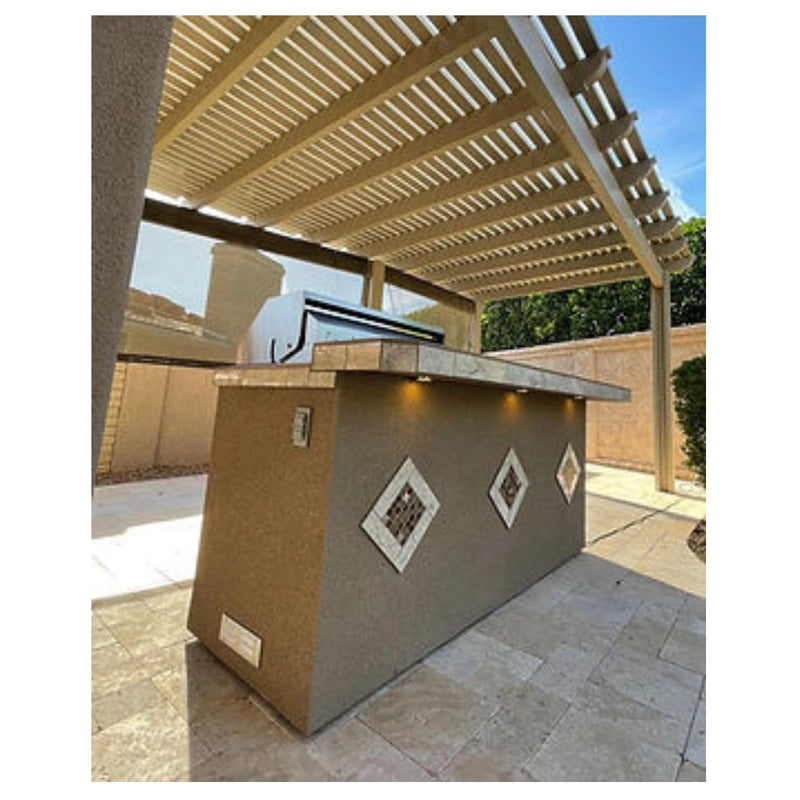 Kokomo Grills St. John 7'6" BBQ Island with Spectrum Brown stucco, tile countertop, three-sided high bar, and built-in lights.