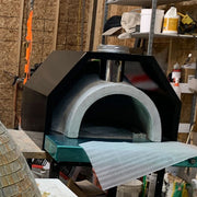 HPC Fire Inspired Di Napoli Series built-in pizza oven with refractory cement, stainless steel chimney, and arched front design.