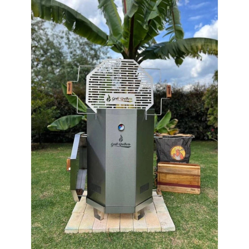 Grill Brothers Barrel Mini charcoal grill with stainless steel body, built-in thermometer, and 12-hook hanging system for versatile outdoor cooking.