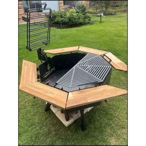 Grill Brothers Grill Stoker outdoor iron fire pit with teak wood accents, folding grills, and adjustable legs in cactus gray.