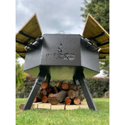 Grill Brothers Grill Stoker with 3mm iron, teak wood supports, dual folding grills, and adjustable legs in cactus gray finish.