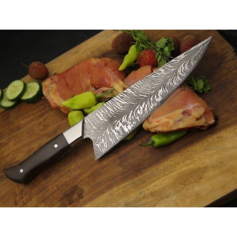 Grill Brothers KNIVES 8-inch stainless steel chef knife with patterned blade and ergonomic dark handle on wooden board with meat and vegetables.