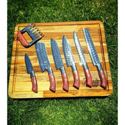 Grill Brothers SET KNIVES professional high-carbon steel BBQ knife set with ergonomic wooden handles on wooden cutting board.