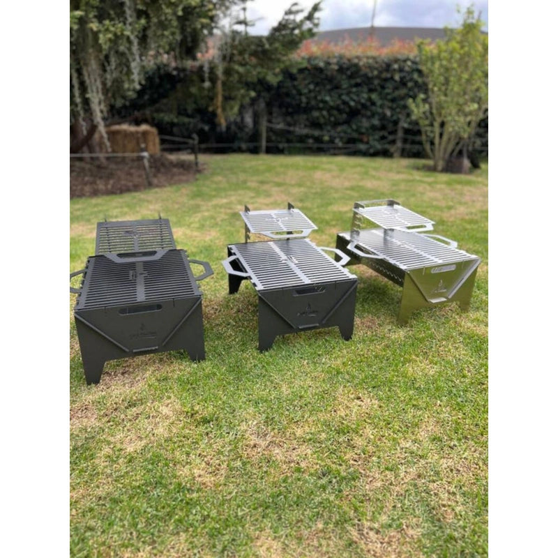 Grill Brothers TO GO Grill portable three-version set in cactus gray iron, hybrid, and stainless steel with adjustable cooking heights.