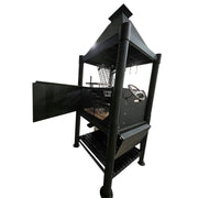 Tagwood BBQ The Beast Argentine Santa Maria Style black steel grill with peaked roof, swivel grate, and firebox doors open.