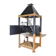 Tagwood BBQ The Beast Argentine Santa Maria Style black wood fire grill with steel grates, wooden frame, and peaked roof design.