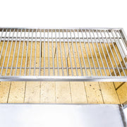 Tagwood BBQ Freestanding Argentine Santa Maria Grill with stainless steel adjustable grates and ceramic firebox for wood and charcoal cooking.