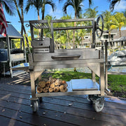 Tagwood BBQ Freestanding Mini Argentine Santa Maria wood fire grill with stainless steel, adjustable grates, and charcoal brasero firebox.