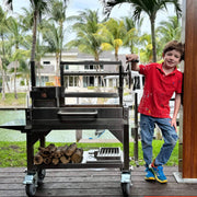 Tagwood BBQ Freestanding Mini Argentine Santa Maria Grill with stainless steel, adjustable grates, brasero firebox, and compact portable design.