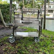 Tagwood BBQ Freestanding Mini Argentine Santa Maria Grill with 304 stainless steel, height-adjustable grates, and wheeled portable design.