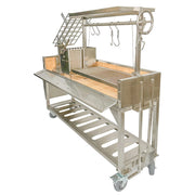 Tagwood BBQ Freestanding Argentine Santa Maria Grill with stainless steel, height-adjustable grates, gaucho firebox, and peaked roof on wheels.