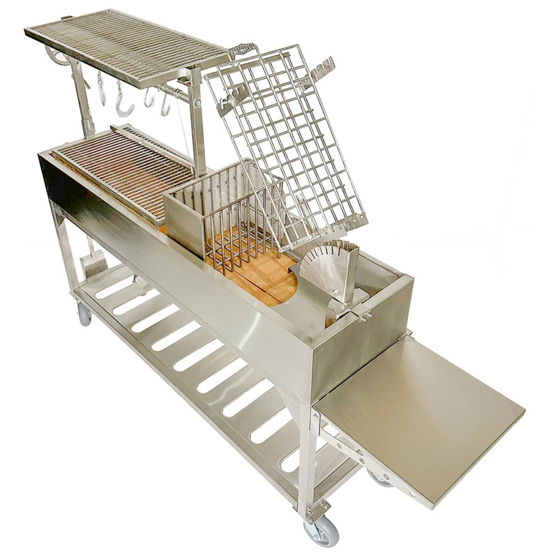 Tagwood BBQ Freestanding Argentine Santa Maria Wood Fire & Charcoal Gaucho Grill BBQ06SS in stainless steel with adjustable grates and peaked roof.