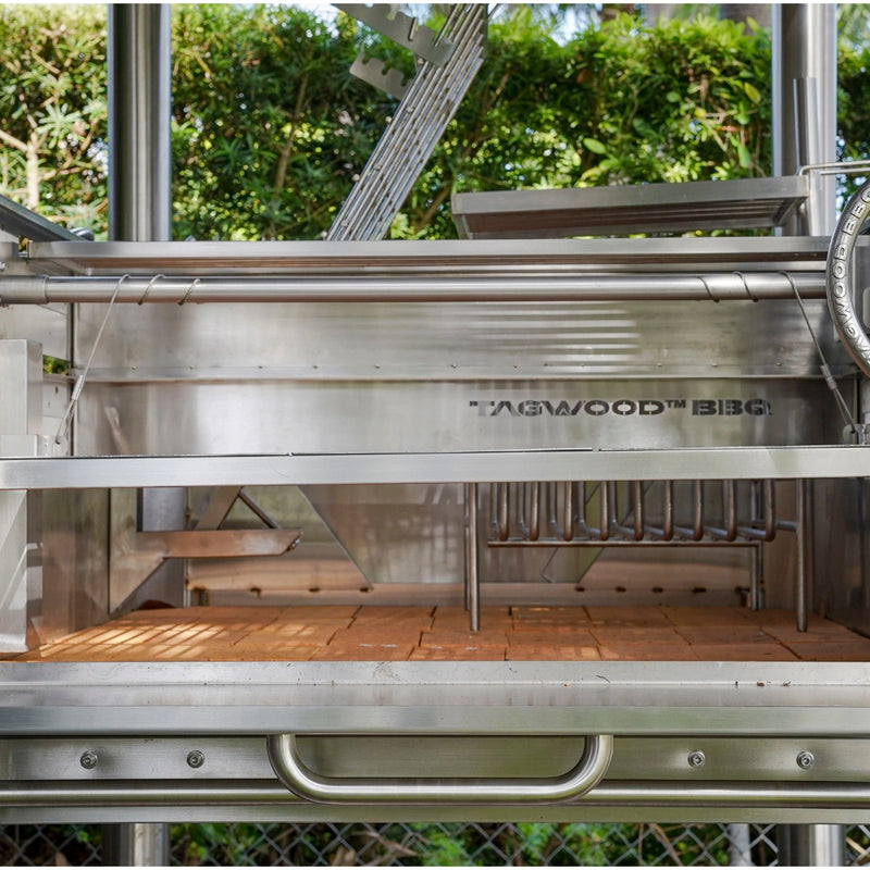 Tagwood BBQ Santa Maria Wood Fire & Charcoal Gaucho Grill BBQ12SS with stainless steel, firebrick interior, and adjustable grates for versatile grilling.