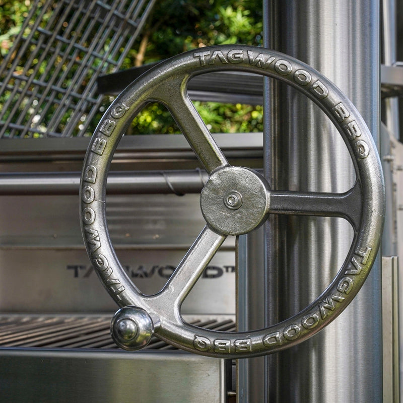 Tagwood BBQ Santa Maria Wood Fire & Charcoal Gaucho Grill all SS304 with stainless steel height-adjustable grate wheel and heavy-duty construction.