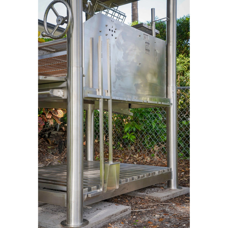 Tagwood BBQ Santa Maria Wood Fire & Charcoal Gaucho Grill BBQ12SS with stainless steel frame, adjustable grates, and vertical firebox handles.